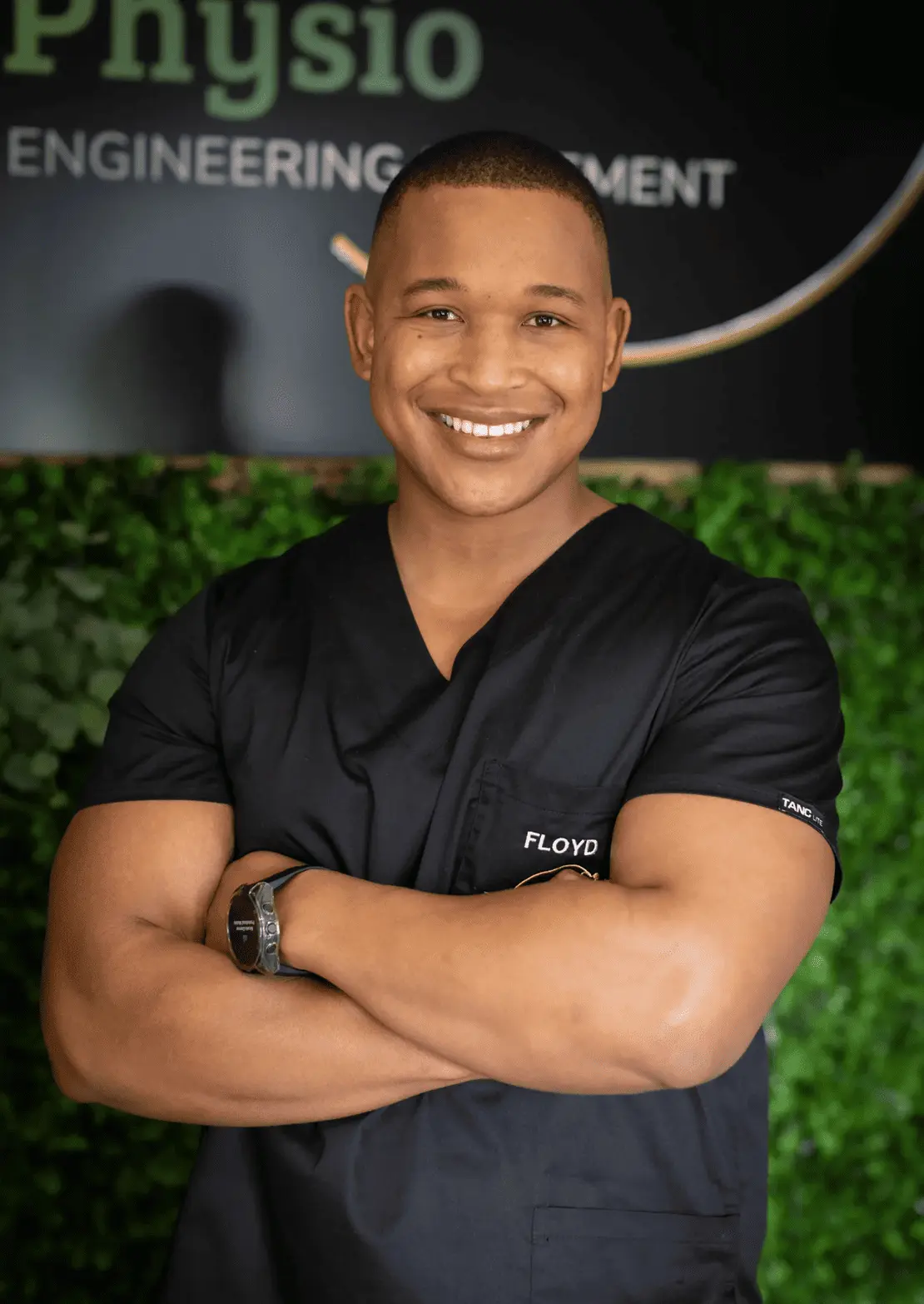 Meet Our Experts 1 Floyd Lebatie, founder and sports physiotherapist at Midrand clinic, wearing black clinical scrubs